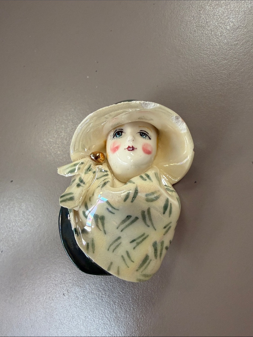 1985 Ceramic Lady Figurine Brooch in Cream green hat with gold trim and scarf